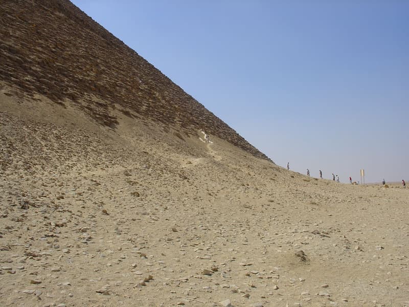 Visitors climbing the steps to the Red Pyramid entrance